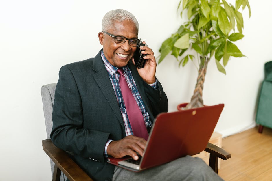 senior man on phone and laptop