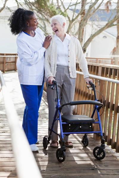 caregiver vacuuming room